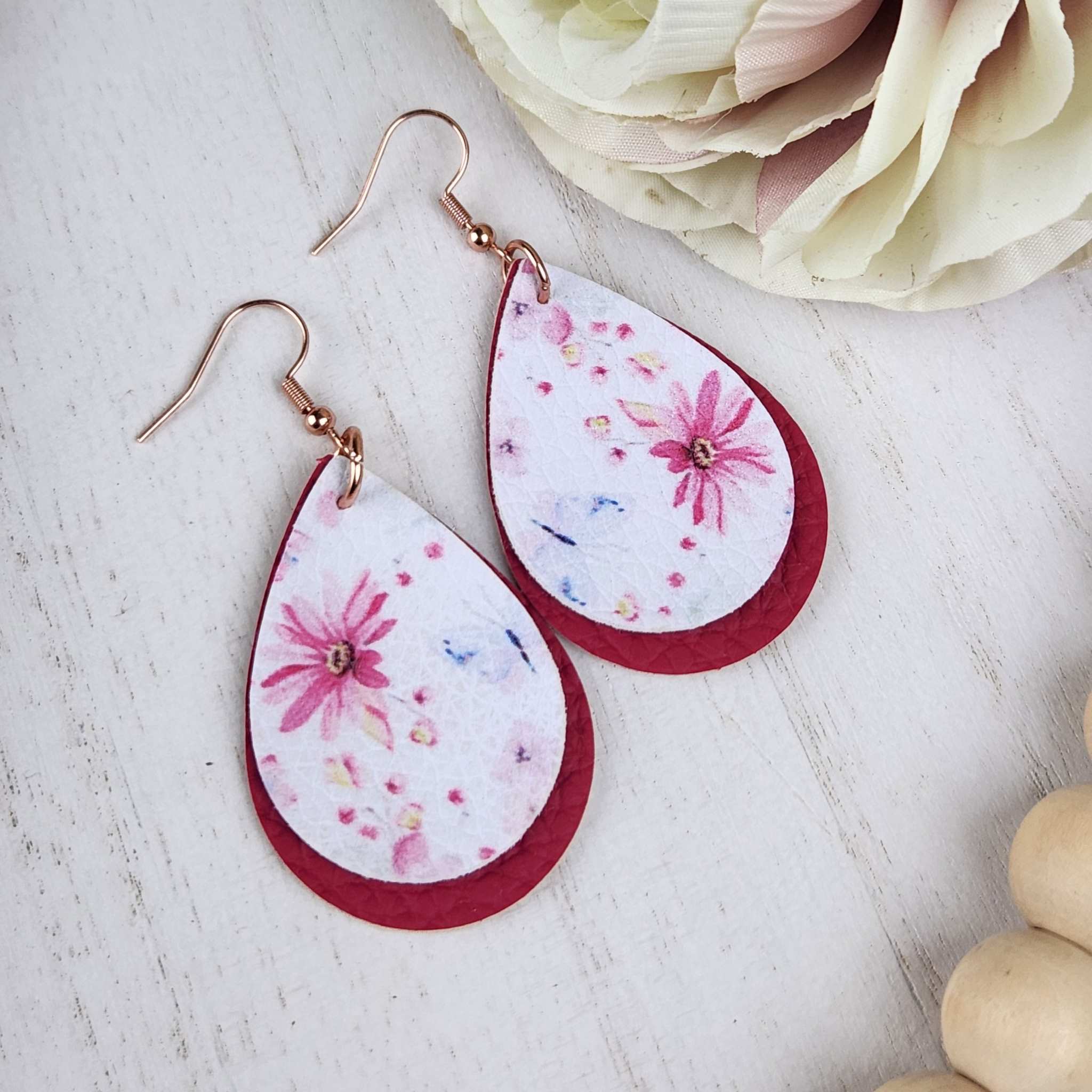 Floaral faux leather teardrop earrings, made with Hypoallergenic hooks.