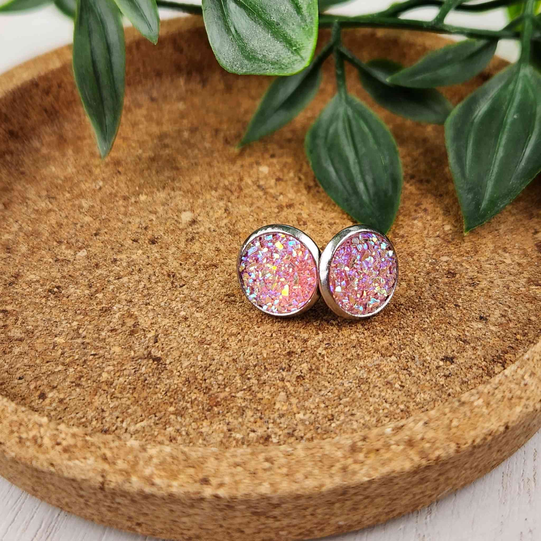 Beautiful pink/peach shimmering crystal cluster studs. Studs are hypoallergenic and are 10mm in diameter.