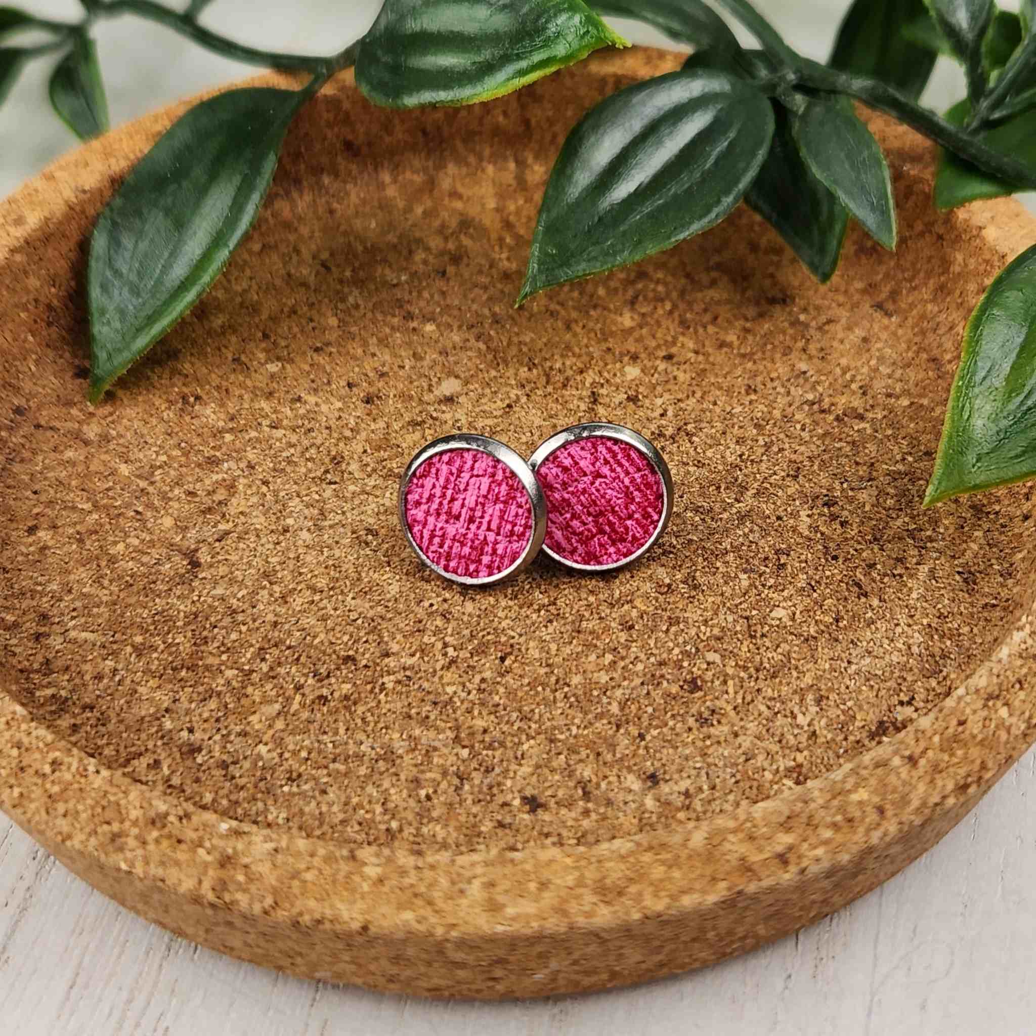 These cute studs have a pink faux leather inlay. They are made with hypoallergenic findings, and are 10mm in diameter.