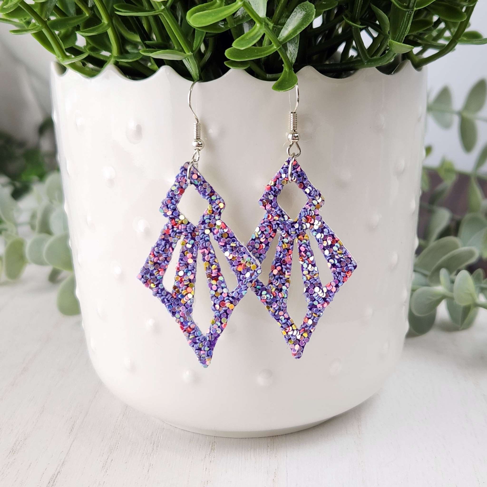 Colorful glitter leather earrings, made with hypoallergenic hooks.