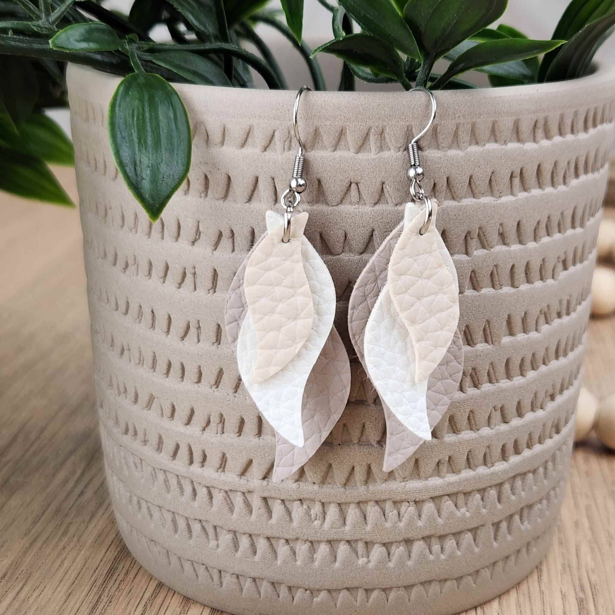 Wavey white and beige leather earrings made with hypoallergenic hooks.