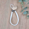 Pure White soother clip with leather braided cord and a wooden clip