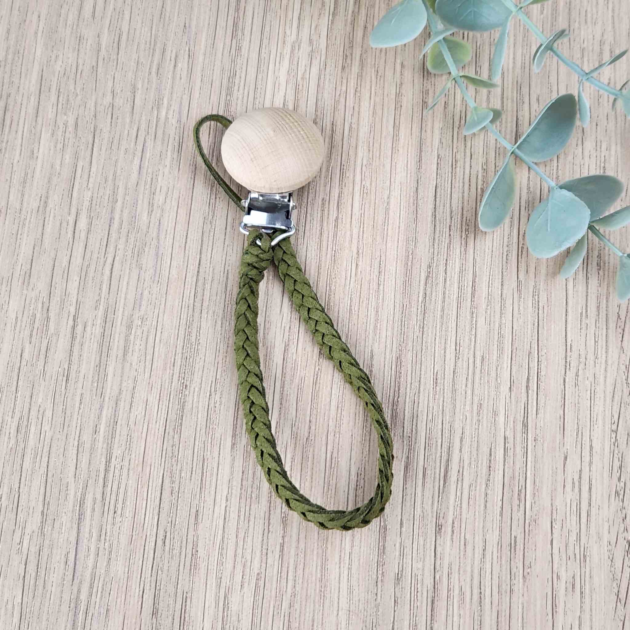 Forest Green soother clip with leather braided cord and a wooden clip