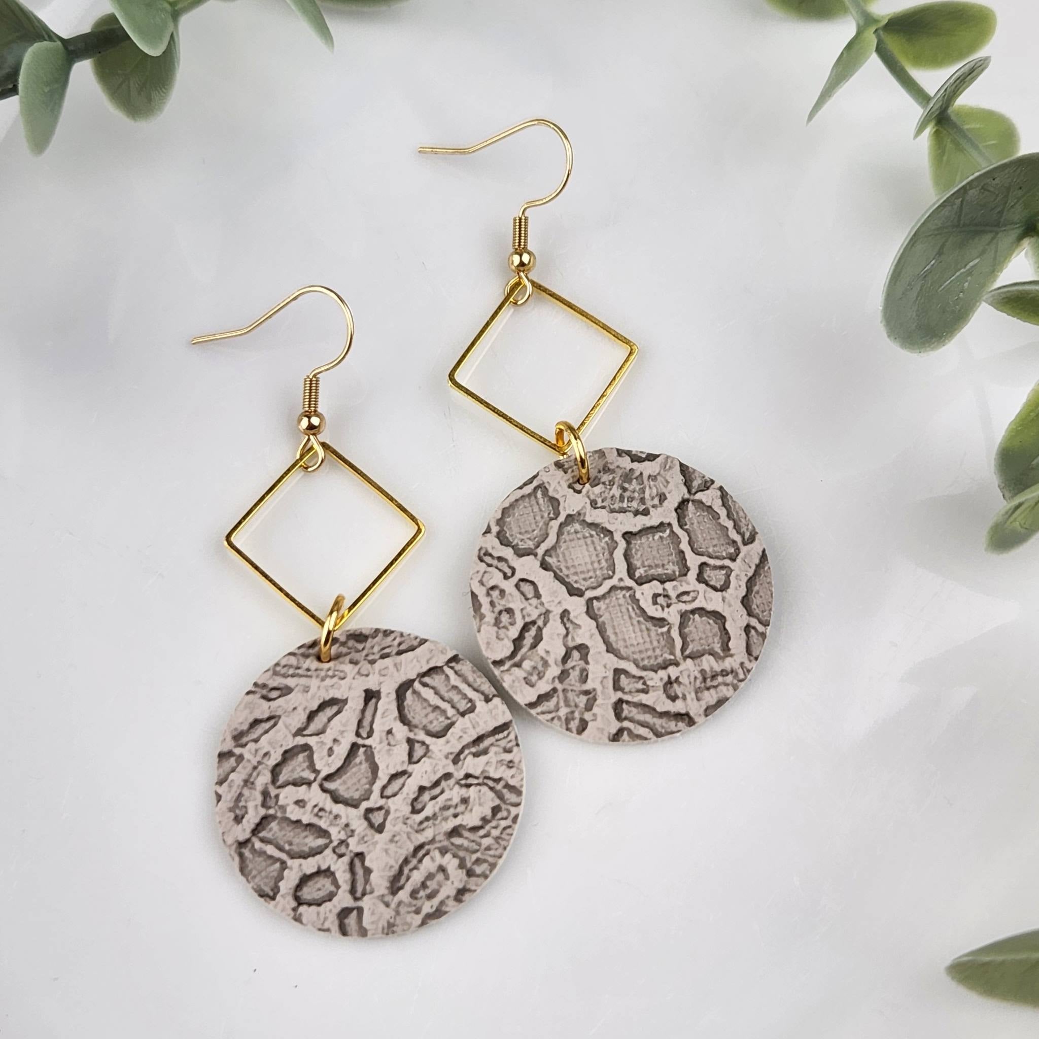 Leather circle earring with square filigree at the top. Hypoallergenic hooks