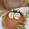 Yellow studs with faux leather sunflower dangles. Hypoallergenic findings were used.