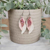 Wavey white and pink leather earrings made with hypoallergenic hooks.