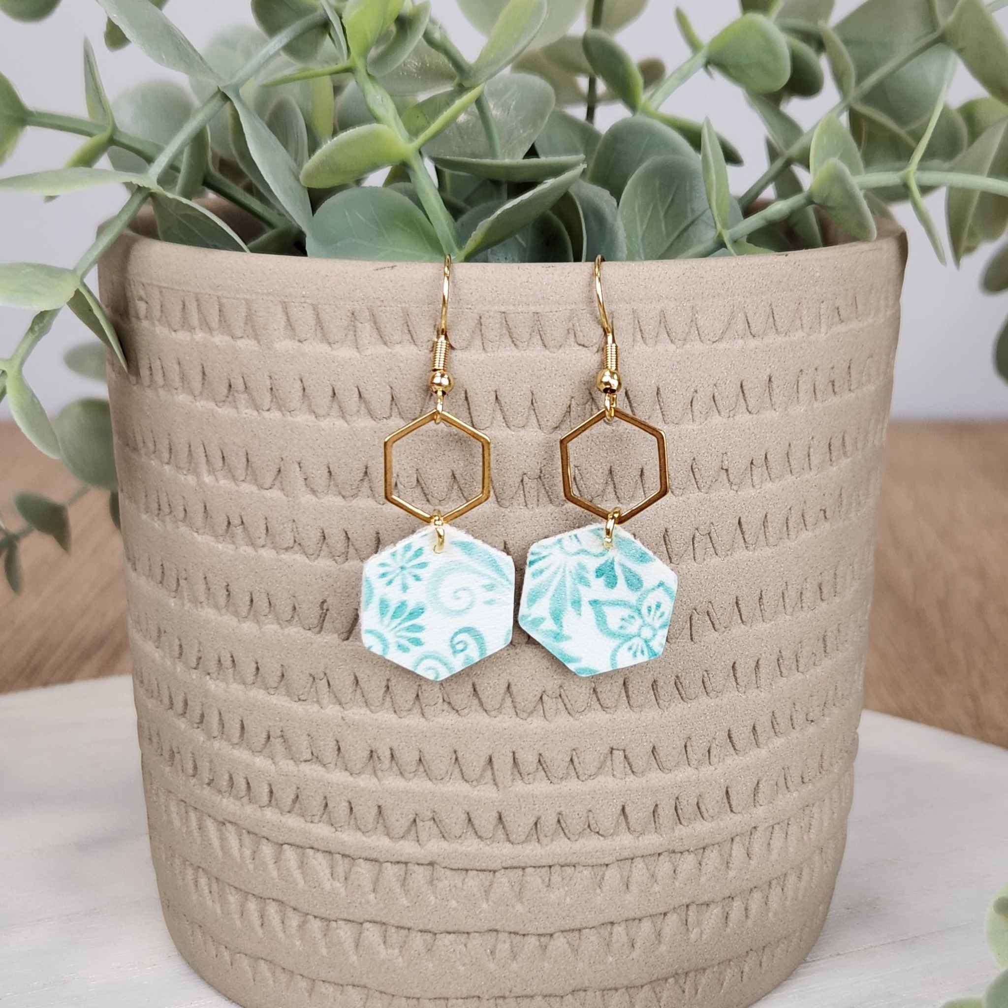 Blue and white floral hexagon earrings made with hypoallergenic hooks.