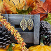 Faux leather and golden leaf filigree earrings. Made with hypoallergenic hooks