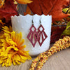 Red arrowhead leather dangles made with hypoallergenic hooks.