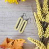 Yellow oval leather earrings made with hypoallergenic hooks