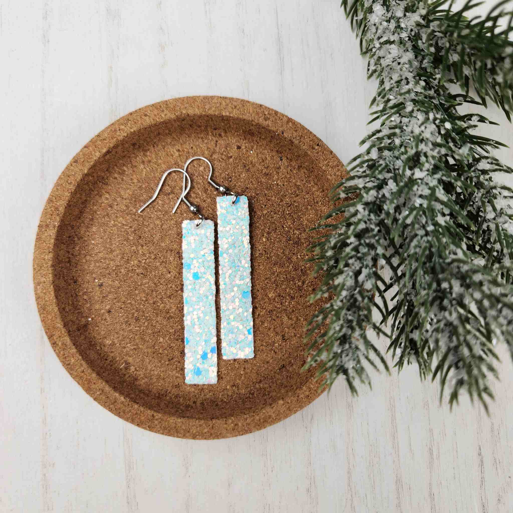 <p>White and blue chunky glitter bar earrings.</p> <p>Made with hypoallergenic hooks.</p>