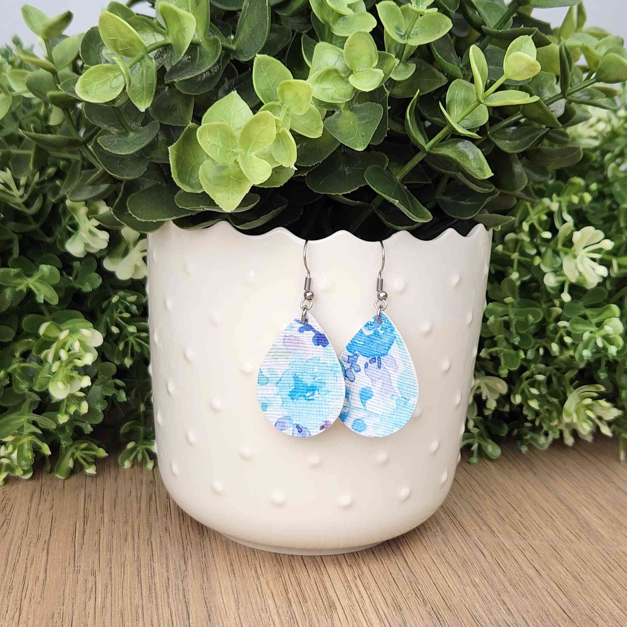 Pastel blue floral watercolor teardrop earrings. Hypoallergenic findings.