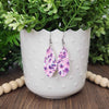 Purple floral glitter dangle earrings. Made with hypoallergenic hooks.