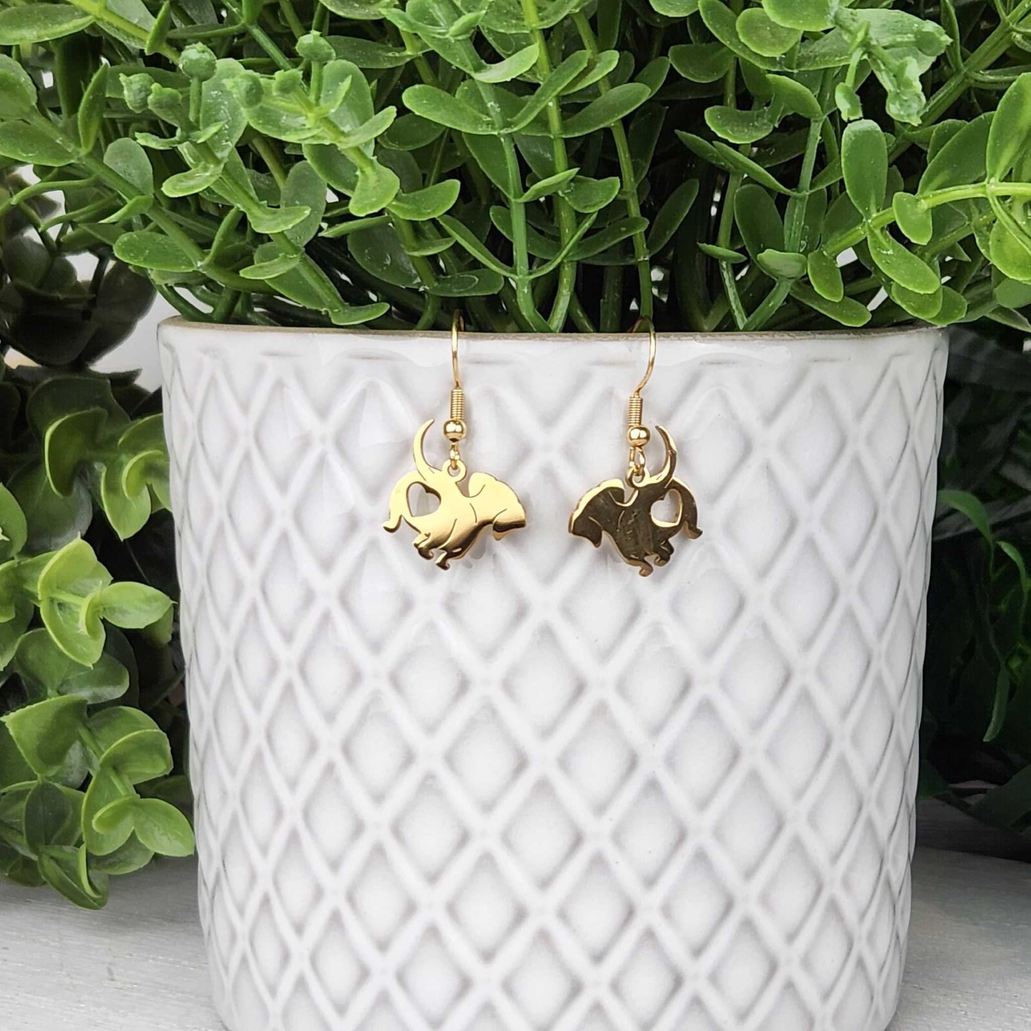 Gold puppy earrings.  Made with hypoallergenic hooks.