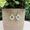 Mint marble diamond shaped earrings with gold flake detail.
Made with hypoallergenic hooks.
30mm in length.