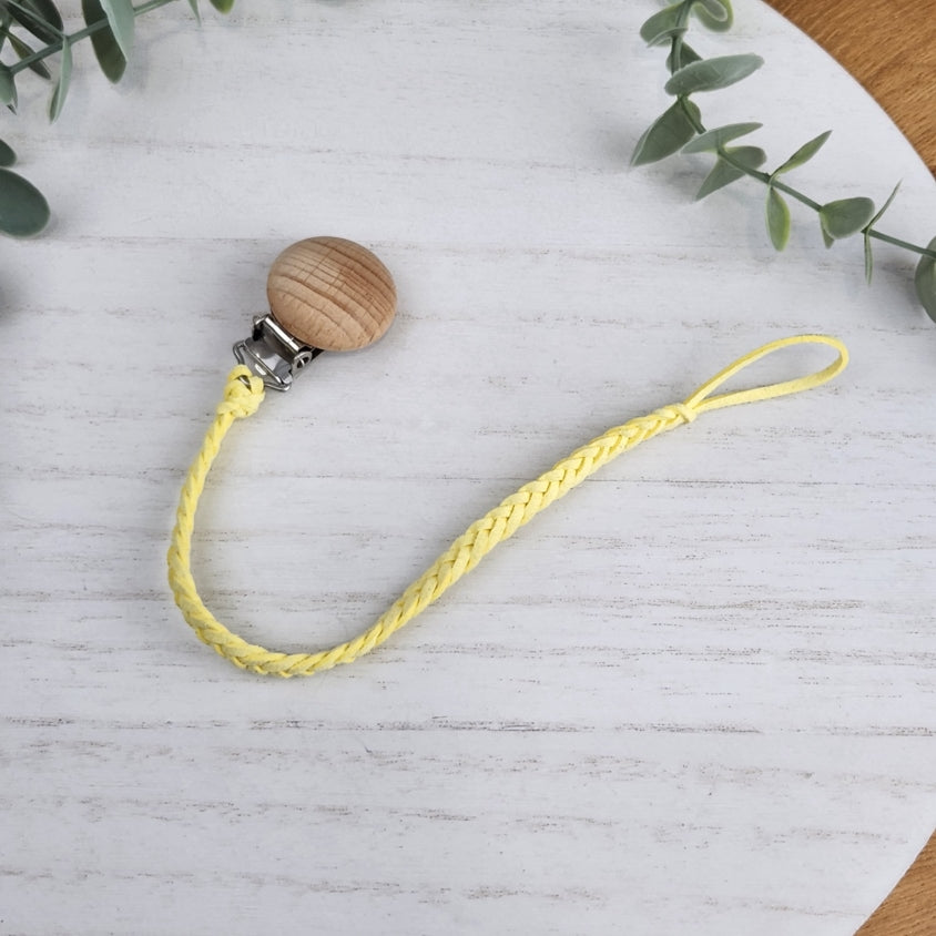 Sunshine Yellow soother clip with leather braided cord and a wooden clip