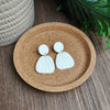 Sand paper textured white clay earrings.
Made with hyopallergenic posts.
35mm in length.