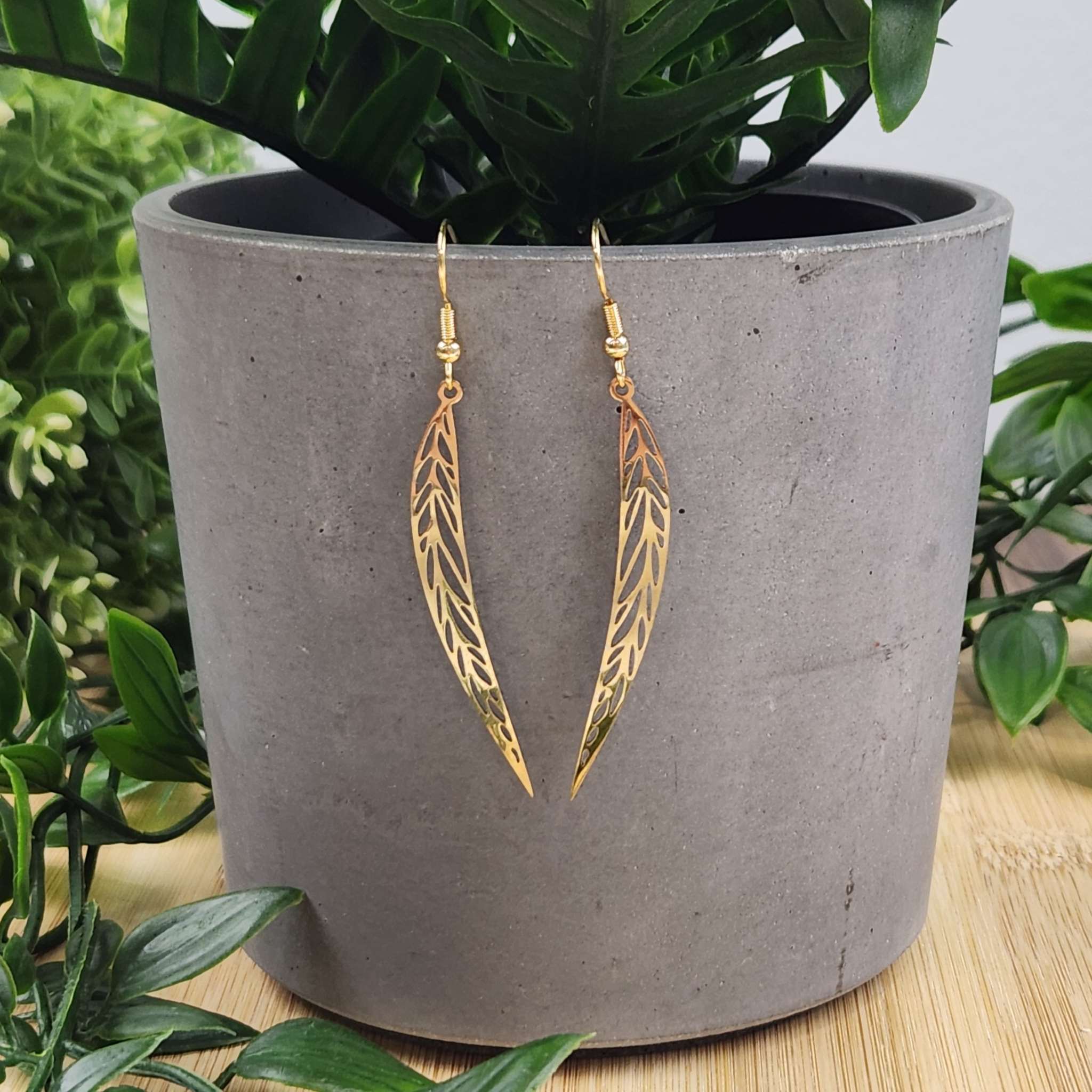 Long narrow gold leaf earrings.Made with hypoallergenic hooks. Length is 50mm in length.